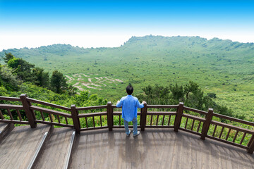 Only man looking Crater View of Songsan Ilchulbong in jeju island.