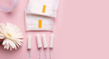 Tender concept of menstruation in women. Table pads and tampons. Copy space