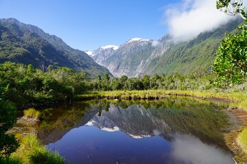 Obraz na płótnie Canvas Lake Matheson - panorama view Mt. Cook and Mt. Tasman - reflection.