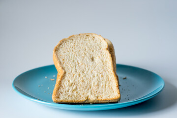 Whole wheat bread on a Blue Plate, Vintage Sweet tone.