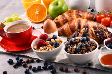 Breakfast served with coffee, juice, croissants and fruits