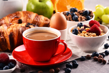 Breakfast served with coffee, juice, croissants and fruits