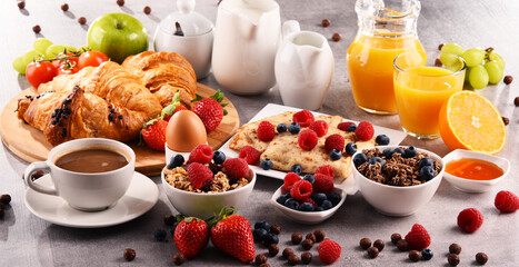 Breakfast served with coffee, juice, croissants and fruits