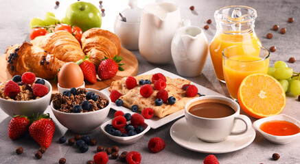 Breakfast served with coffee, juice, croissants and fruits