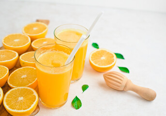 freshly squeezed orange juice and slices of orange fruit