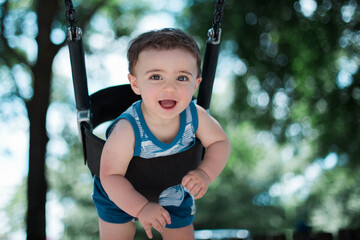 Baby in swing Stock photo Royalty free