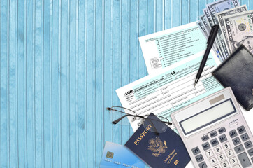 IRS form 1040 Individual income tax return lies on flat lay office table and ready to fill. U.S....