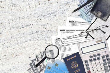 IRS form 1120 U.S. Corporation income tax return lies on flat lay office table and ready to fill....