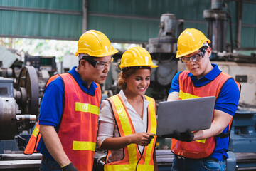 Group of creative asian technician engineer and engineer woman dark skin wearing uniform and safety...