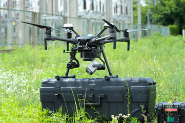 Pro quadcopter with camera and remote control placed on the box before adjusting