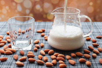 Almond milk process, Almond milk glass jar from extractor juice blender, Health food with good fats and helps slow down aging, Antioxidants and helps to lower cholesterol levels.