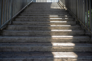 Fototapeta na wymiar overpass concrete staircase with metal hand rail