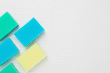 House cleaning and cleaning products. Colored sponges on a white background