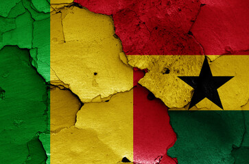 flags of Mali and Ghana painted on cracked wall