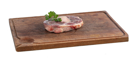 Slice of raw beef shank on a cutting board