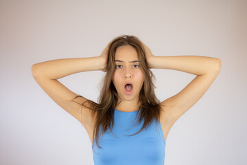 Fototapeta premium Pretty young girl making surprise gesture