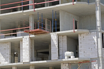 The facade of modern residential building under construction