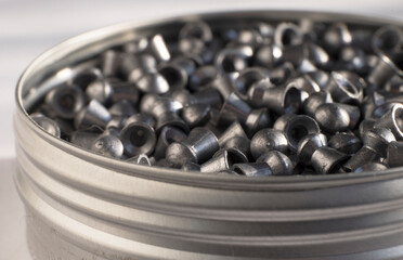 Many hollow airgun bullets for training in a metal can