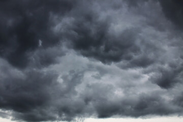 Dark grey rainy clouds in the sky
