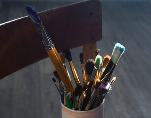 Various paint brushes on sun rays