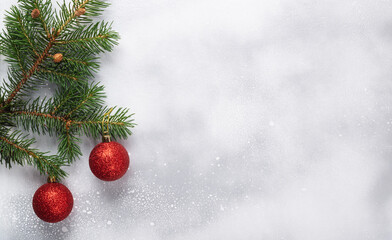 Christmas background with Christmas tree and decorations on a white wooden board.
