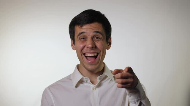A man laughs and pokes a finger