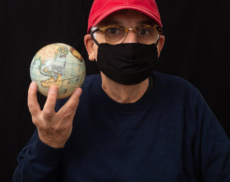 old man with mask and globe
