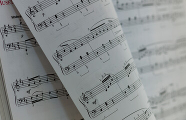 Naklejka premium View of a book with turned page with music notes or notation
