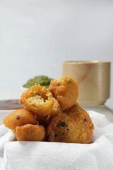 Moong Dal Vada or pakoda/pakora /fritters is Indian  deepfried streetfood served hot with spicy and tangy chutney and tea.