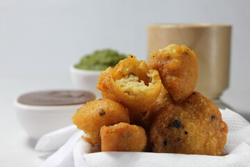 Moong Dal Vada or pakoda/pakora /fritters is Indian  deepfried streetfood served hot with spicy and tangy chutney and tea.