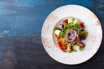 Top view of vegetable salad on a plate. Copy space