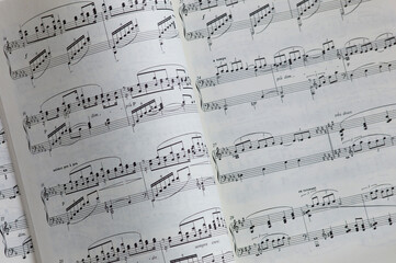 View of a book with turned page with music notes or notation