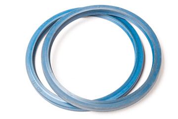 A pair of blue rubber sealing rings on a white isolated background in a photo studio for replacement when repairing a car or for sale when autoparsing.