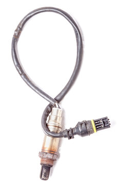 Metal lambda probe is a residual oxygen sensor in the exhaust manifold of an engine on a white isolated background in a photo studio. Spare part for auto diagnostics and repair of car exhaust system.