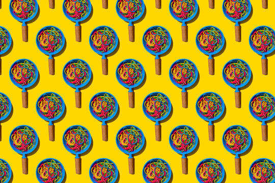 Pattern of toy frying pans with colorful pasta