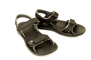 Pair of black leather sandals isolated on white background