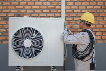 Air Conditioning Technician and A part of preparing to install new air conditioner. Technician...