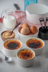creme brulee and ingredients, milk, egg and sugar