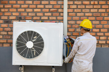 Air Conditioning Technician and A part of preparing to install new air conditioner. Technician...