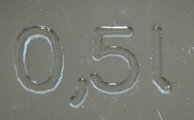 0,5 L Half a litre liter, One Pint, glass, sign, stamping, letters, numbers, close up. NO MORE 0,4 L BS!