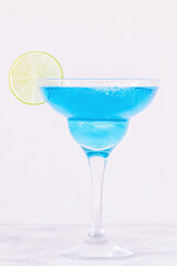 Blue Curacao cocktail decorated with fruit.