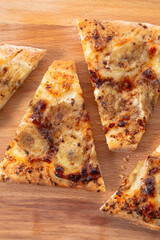 banana pizza on a wooden board