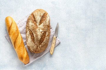 Homemade fresh bread on stone background. French bread. Bread at leaven.