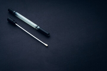 Medical swab closeup on black background. Health care and copy space concept