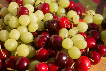 various fresh natural organic berries: cherry and grape