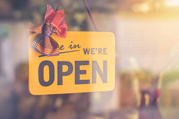 Come in We're open board sign on entrance door to business Hotel, cafe, local shop, service owner...