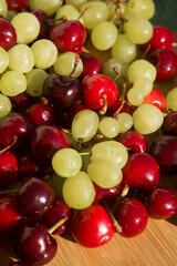 various fresh natural organic berries: cherry and grape
