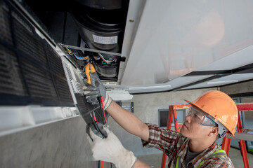 Air Conditioning Technician Repairing Air Conditioner and install new air conditioner. young Asia Repairing Air Conditioning concept