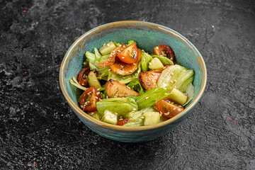 chinese salad in black bowl in restaurant