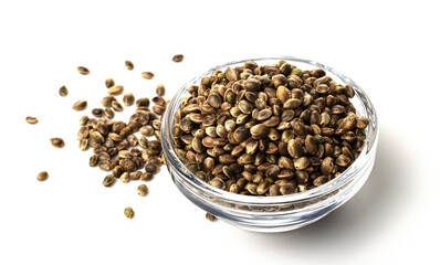 raw hemp seeds in glass packaging isolated on a white background. healthy lifestyle